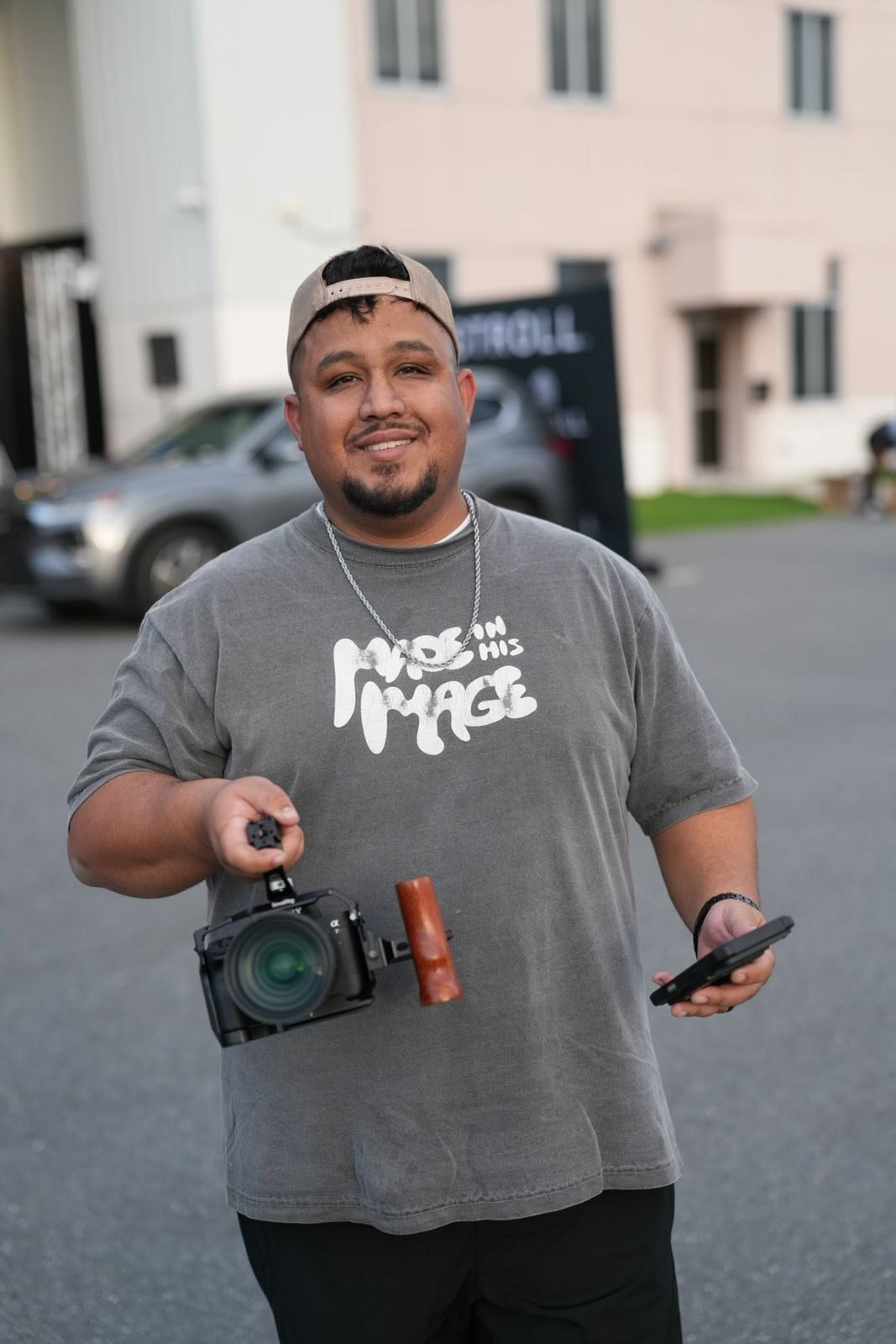 Mikey Cruz holding his camera rig on set