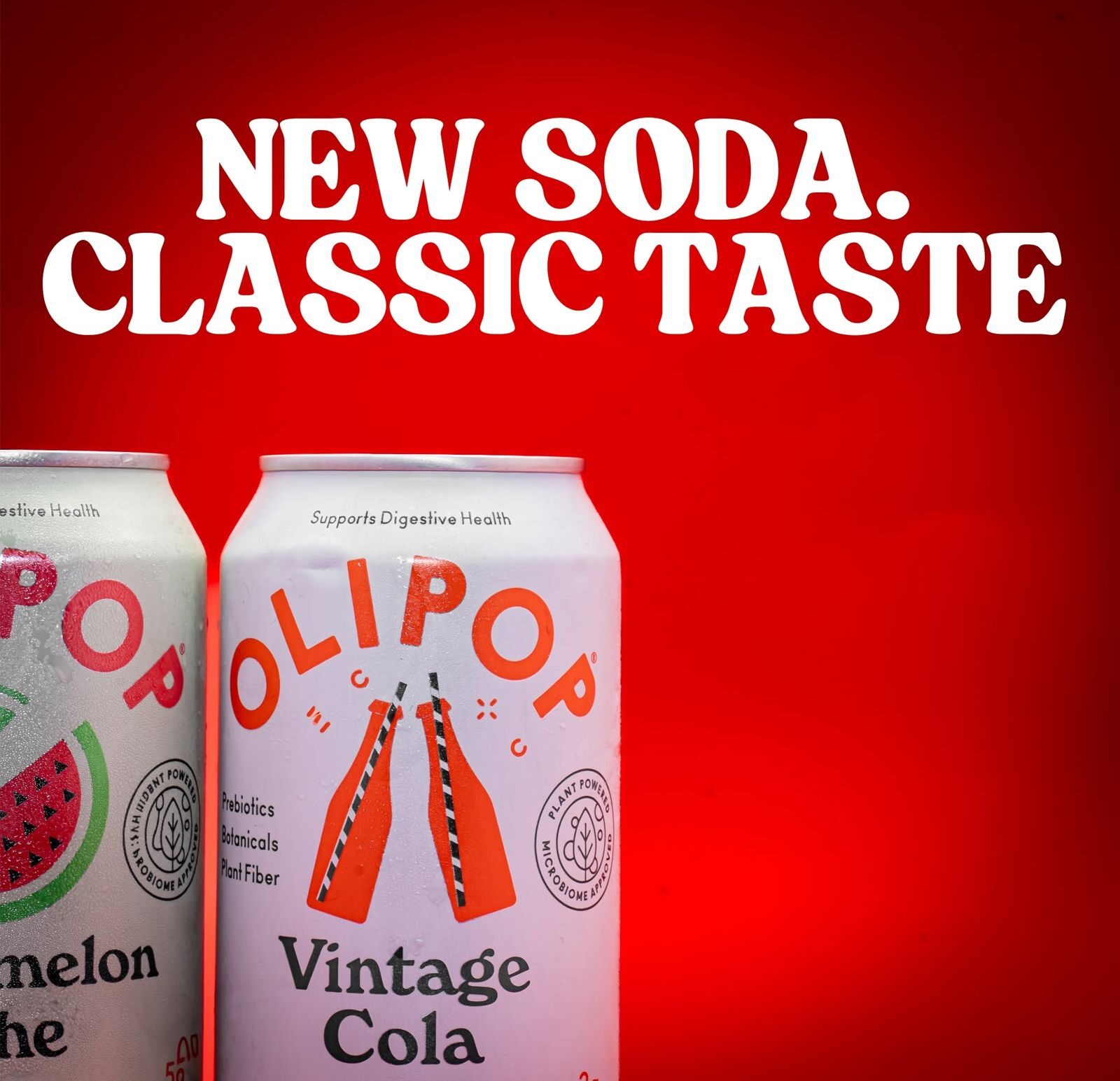 Two soda cans lit against a red backdrop for a product launch